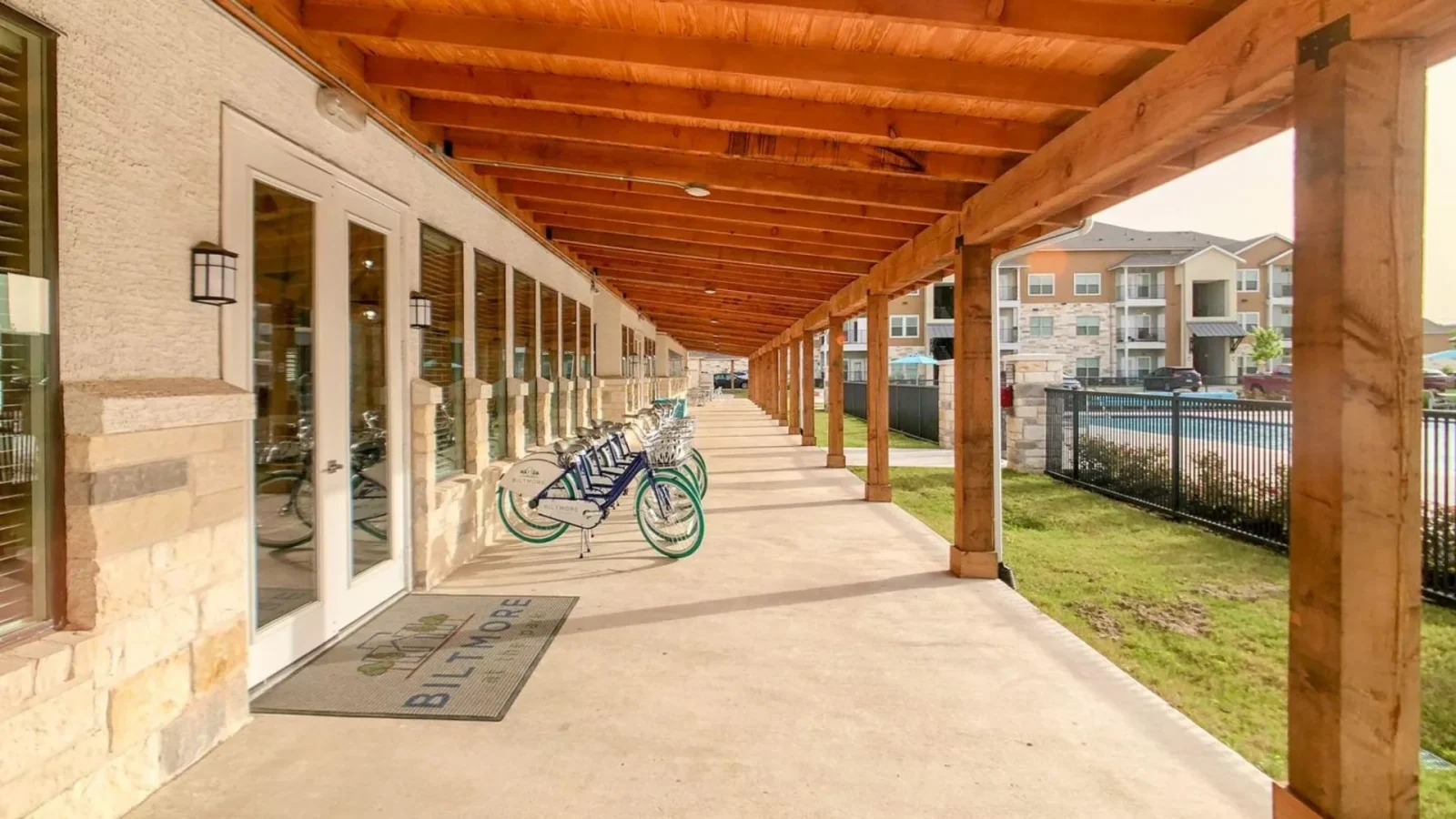 a bike is parked outside of a covered walkway at The Biltmore at  Park