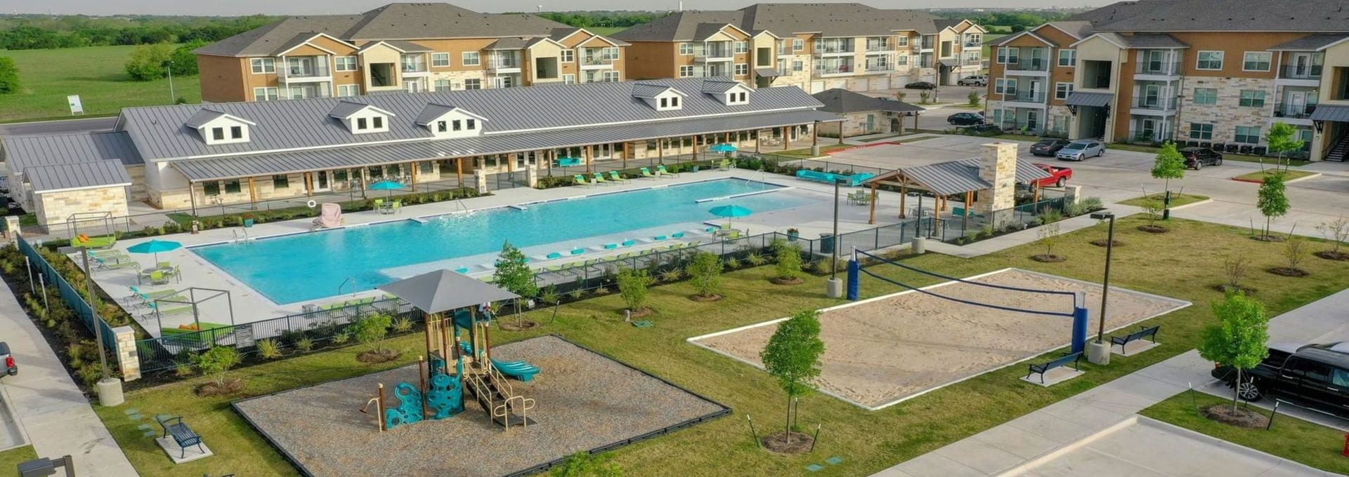 an aerial view of a pool and apartment complex at The Biltmore at  Park